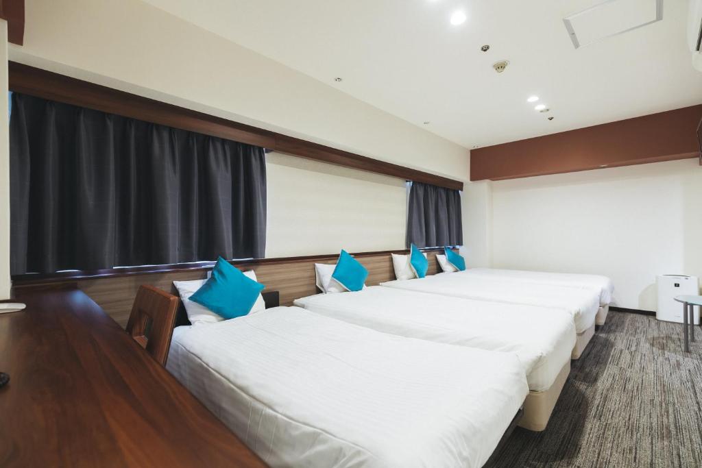 Postel nebo postele na pokoji v ubytování Cityroute Hotel