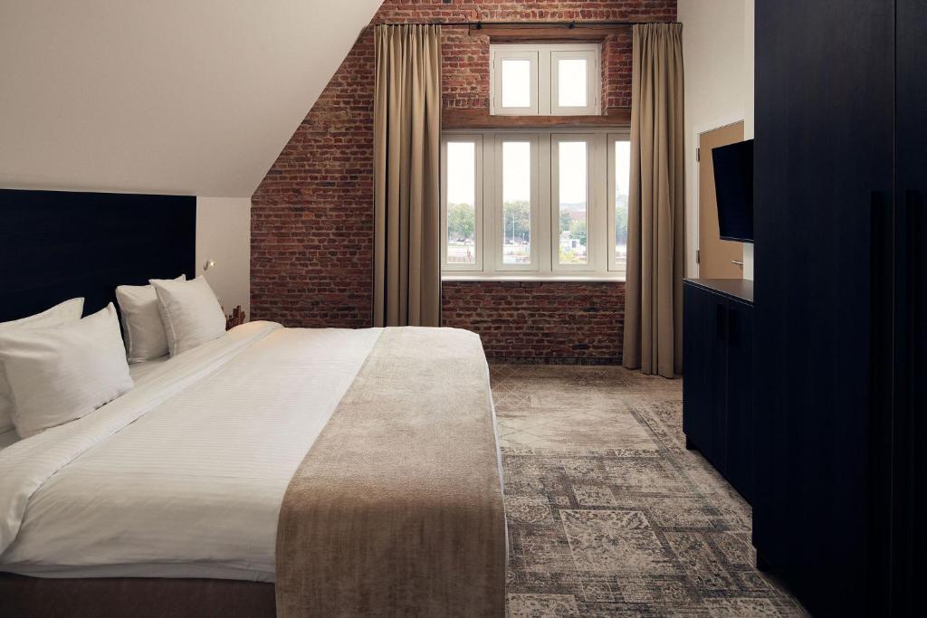 Postel nebo postele na pokoji v ubytování Van der Valk Hotel Mechelen