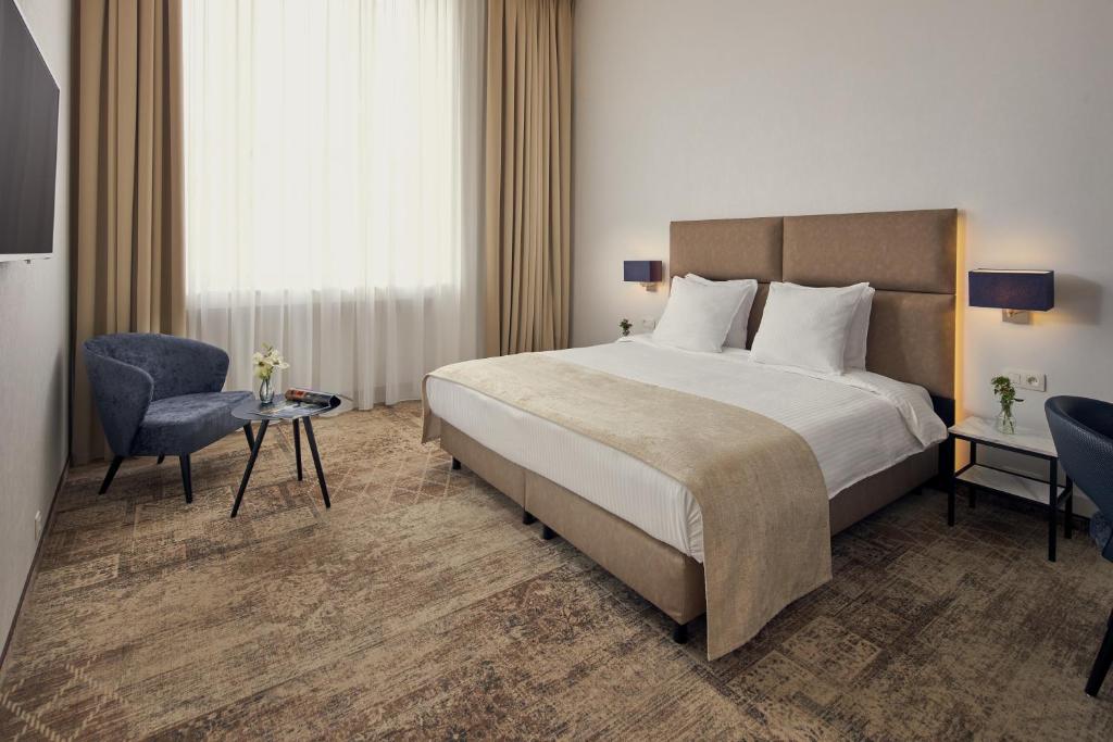 Postel nebo postele na pokoji v ubytování Van der Valk Hotel Mechelen