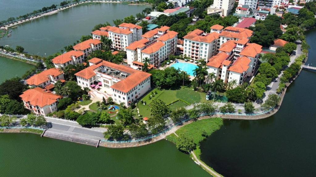 an aerial view of a house on an island in the water at Diamond Westlake Suites in Hanoi