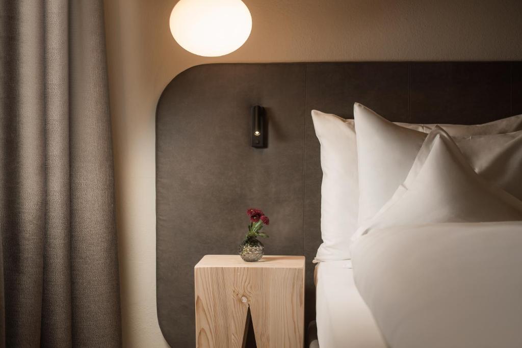 Postel nebo postele na pokoji v ubytování Naturhotel MOLIN