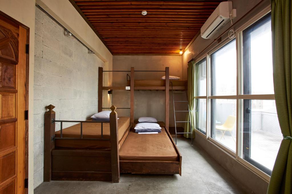 Postel nebo postele na pokoji v ubytování Untapped Hostel