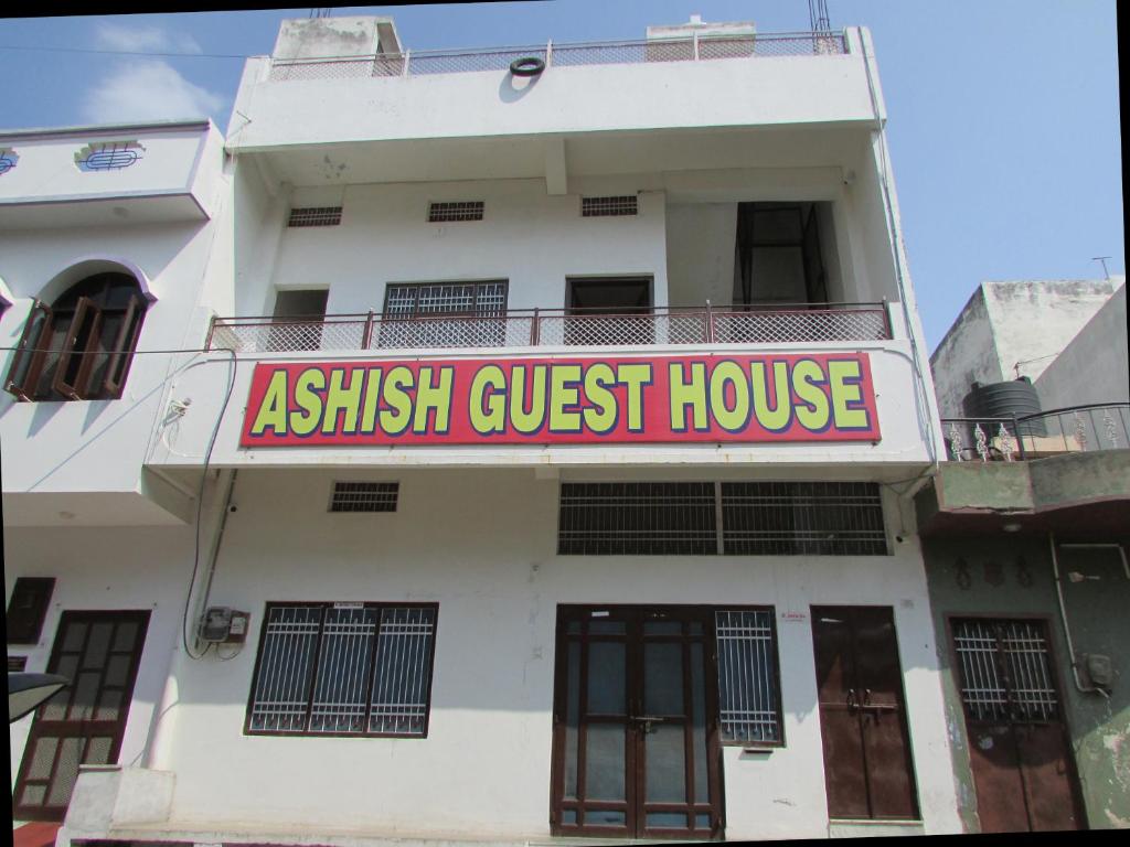 a building with a sign that reads ashkrit guest house at Ashish Guest House, Goverdhan Vilas in Udaipur