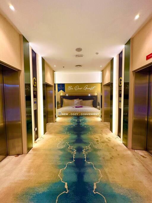 a hotel room with a pool of water on the floor at Kuching Kozi Square Apartment III in Kuching