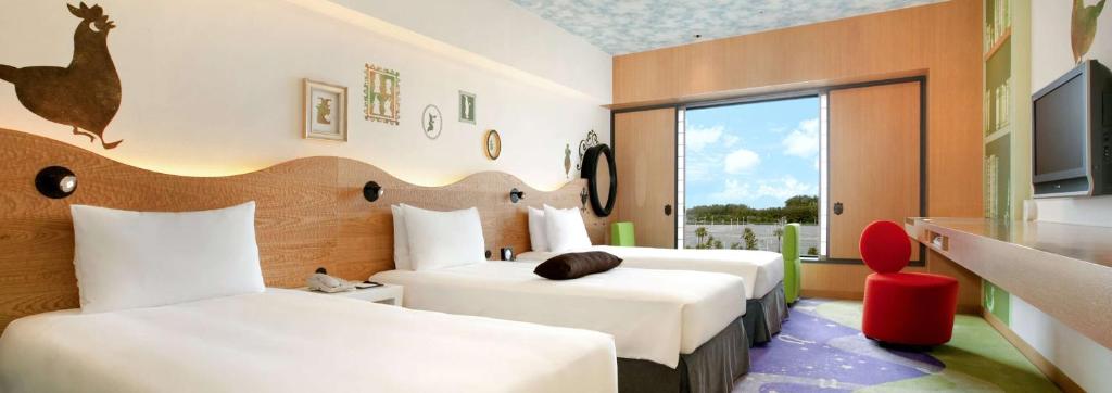 Postel nebo postele na pokoji v ubytování Hilton Tokyo Bay