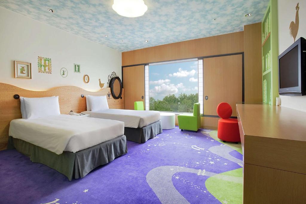 Postel nebo postele na pokoji v ubytování Hilton Tokyo Bay