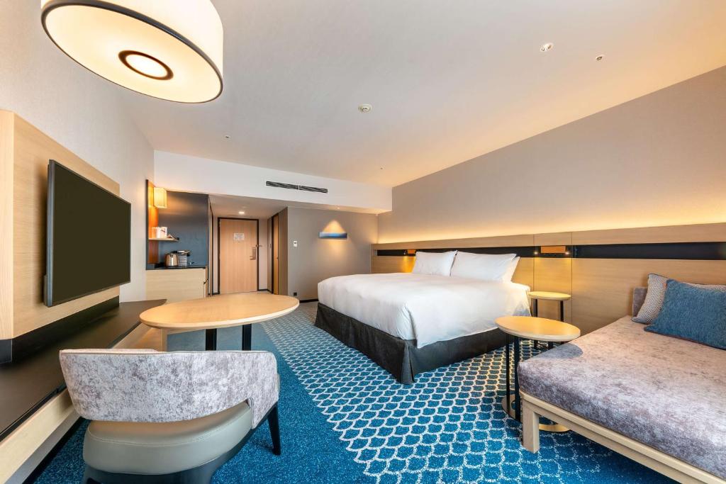 Postel nebo postele na pokoji v ubytování Hilton Tokyo Bay
