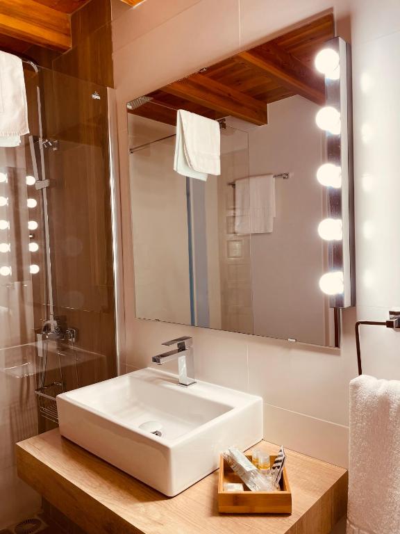 a bathroom with a white sink and a mirror at Moli l&#39;Abad in Puebla de Benifasar