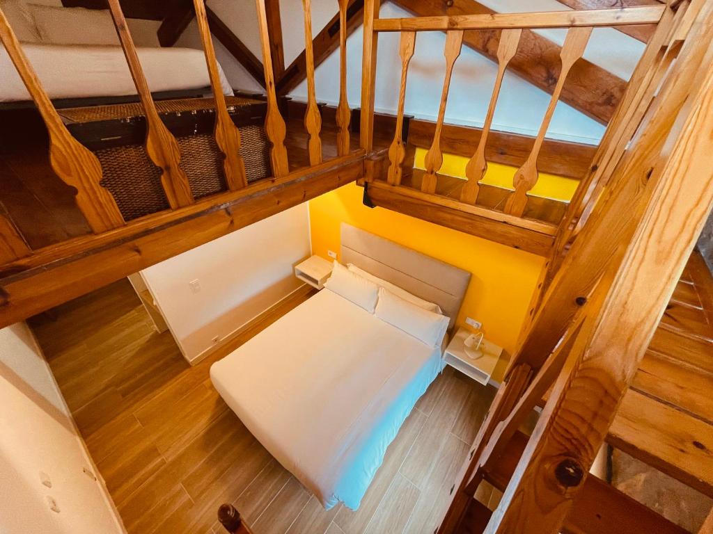 an overhead view of a room with a couch and stairs at Moli l&#39;Abad in Puebla de Benifasar