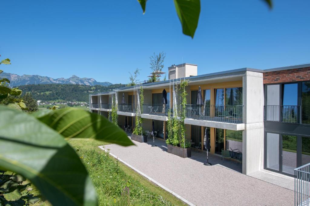 an exterior view of a building with plants at Livingreen Residences in Feldkirch