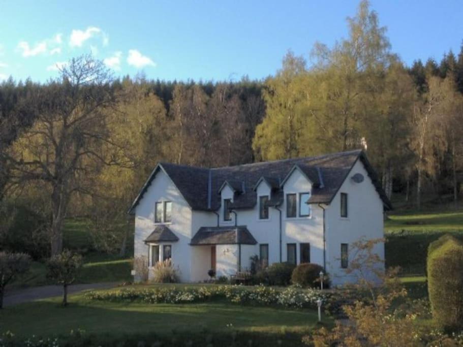 a white house with a black roof at The Keepers in Aberfeldy