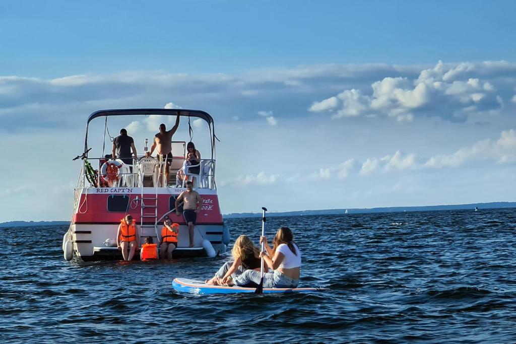 a group of people on a boat in the water at KUHNLE-TOURS GmbH Malchin in Malchin
