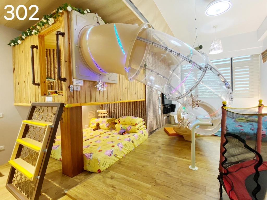Postel nebo postele na pokoji v ubytování Wind Natural Parent-child Inn