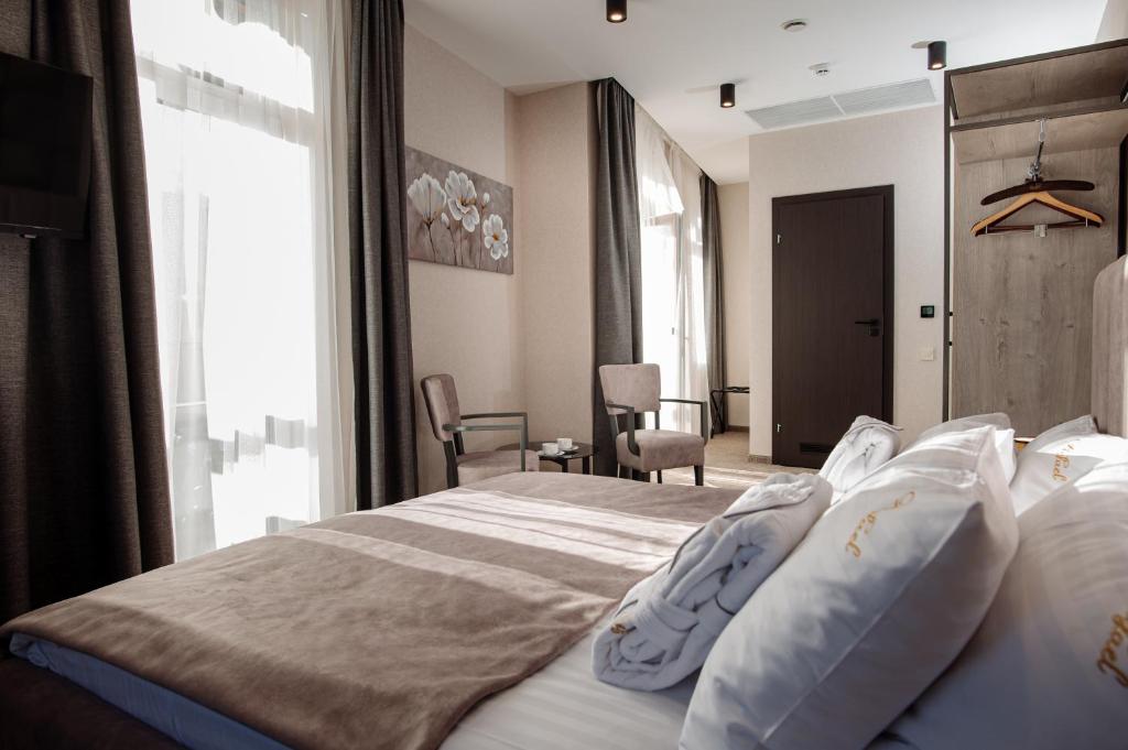 Postel nebo postele na pokoji v ubytování Hotel Boutique Refael