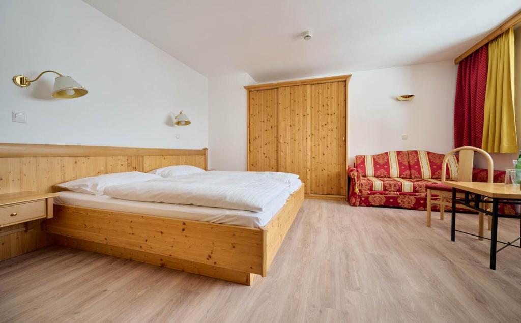 Postel nebo postele na pokoji v ubytování Heart Hotel Aurora