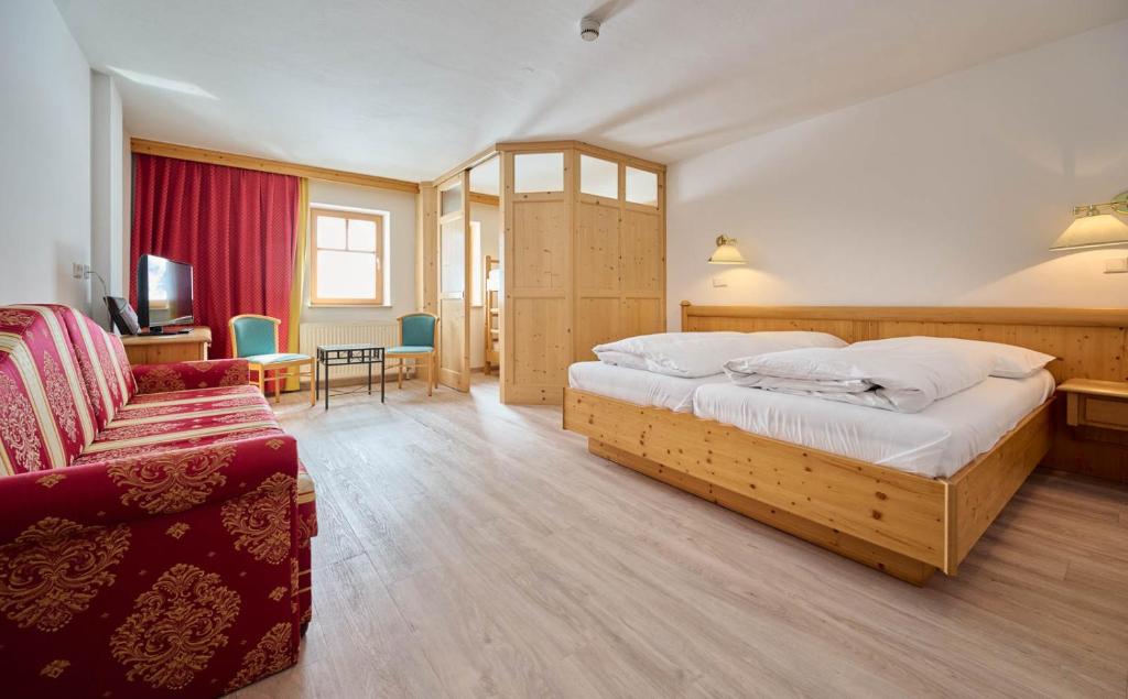 Postel nebo postele na pokoji v ubytování Heart Hotel Aurora