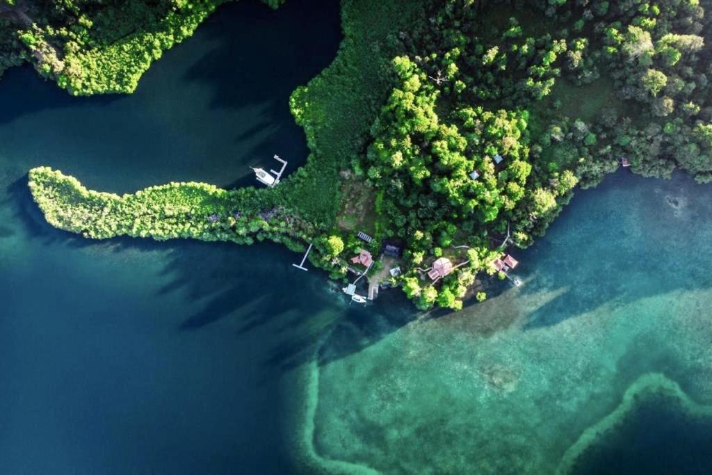 an aerial view of an island in the water at Akwaba Lodge in The Gap