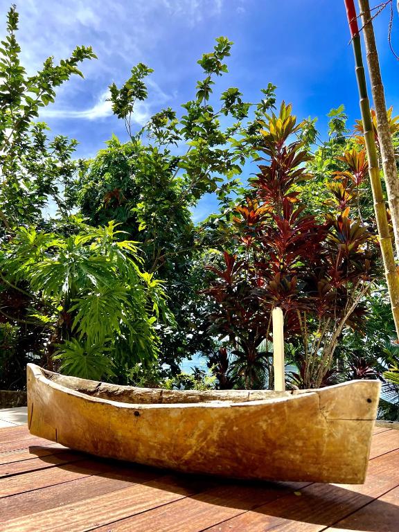 a wooden boat sitting on top of a wooden deck at Akwaba Lodge in The Gap