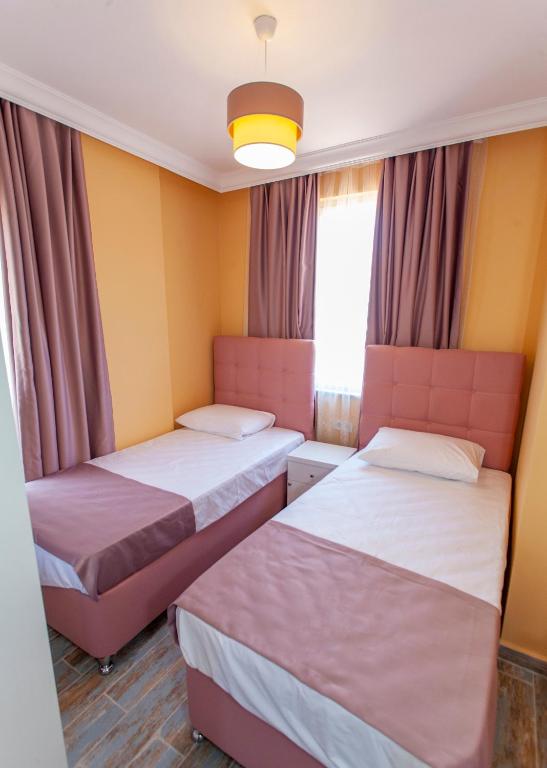 Postel nebo postele na pokoji v ubytování Roses Villa