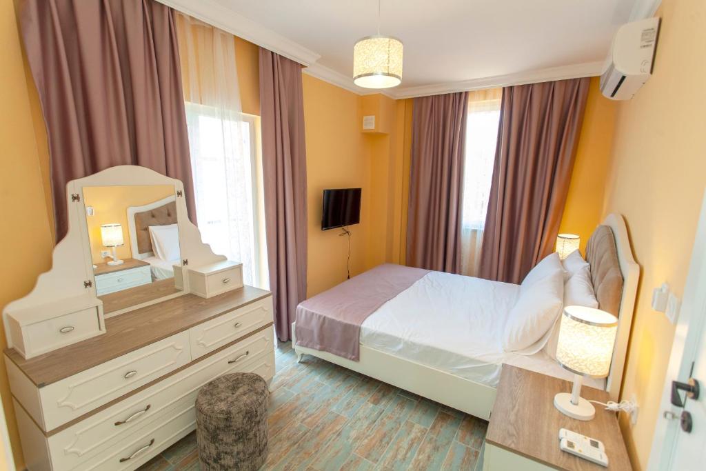 Postel nebo postele na pokoji v ubytování Roses Villa