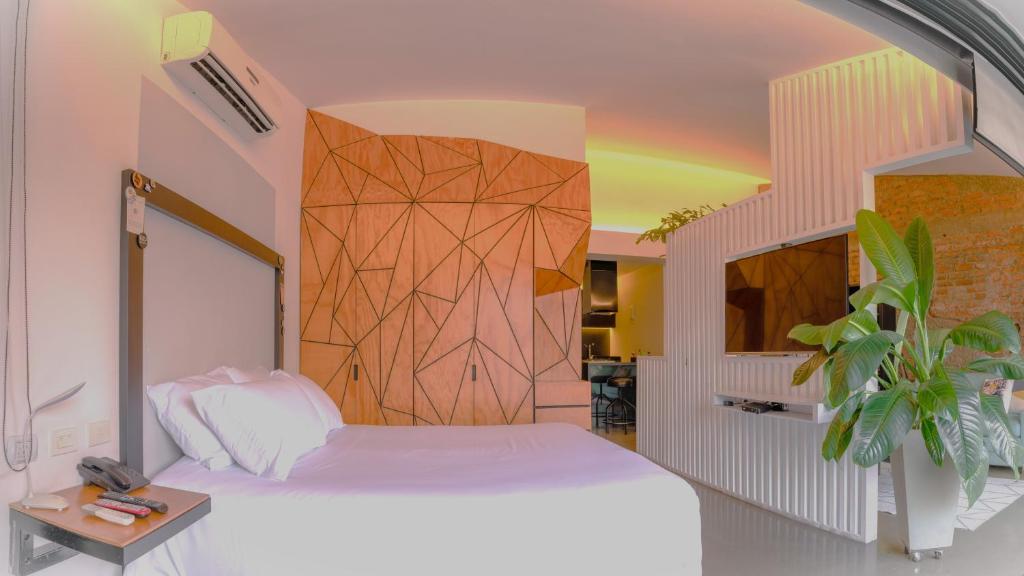 Uma cama ou camas num quarto em Hotel El Peñon by Bithotels
