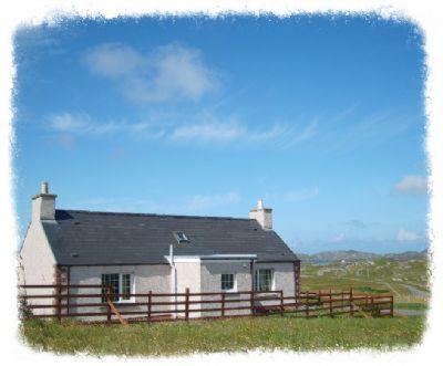 a small white house with a fence in a field at Harsgeir View Holiday Cottage -Wifi Go green in Breaclete