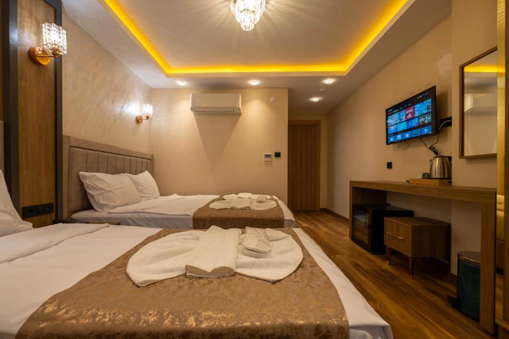 En eller flere senge i et værelse på HOPEFULL HOTEL