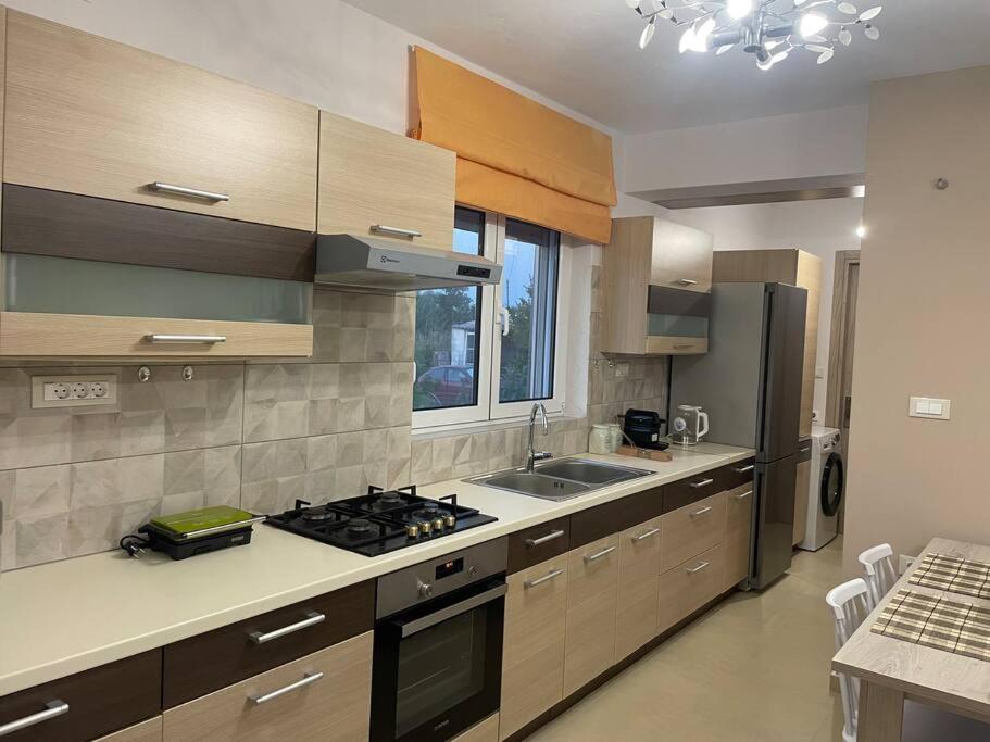 a kitchen with a sink and a stove top oven at Anastasia’s Home in Chania