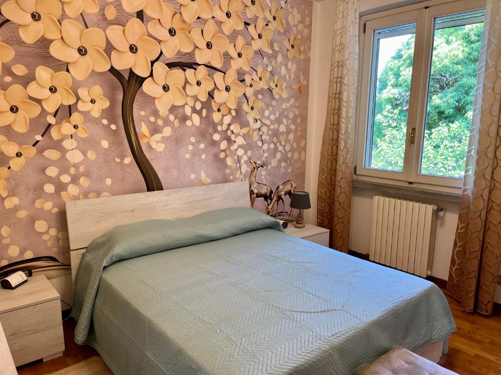 Postel nebo postele na pokoji v ubytování LUKAS HOME CON IL CUORE Appartamento 3 camere al piano terra e appartamento 1 camera in taverna