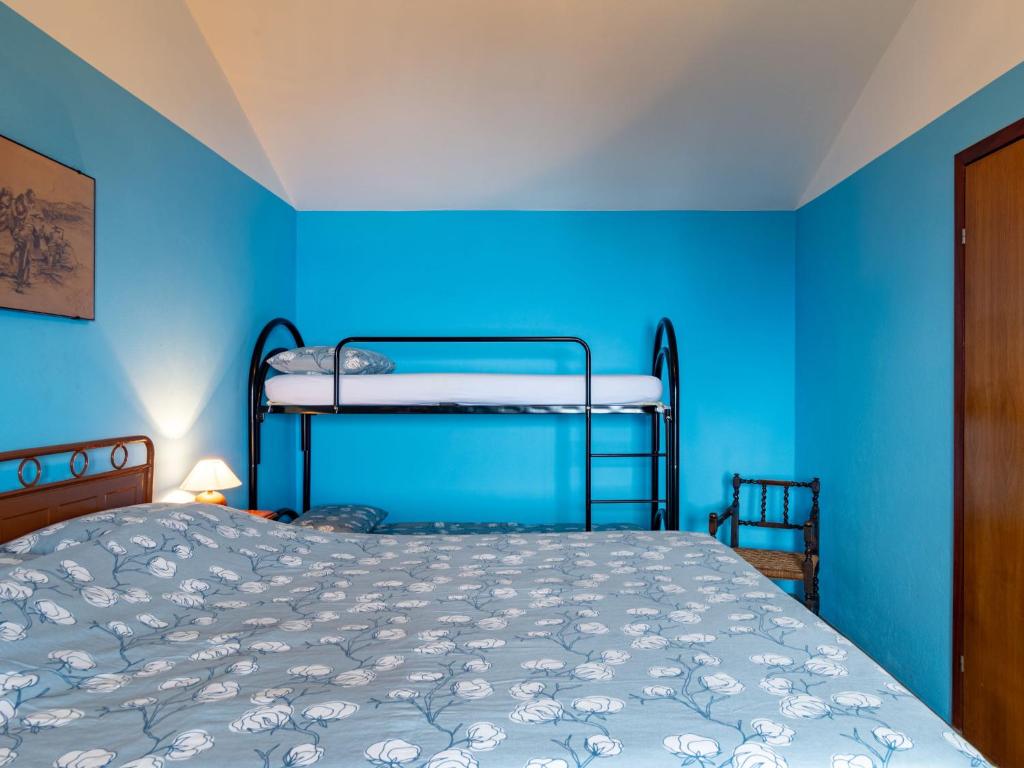 A bed or beds in a room at Holiday Home Munt del Nana by Interhome