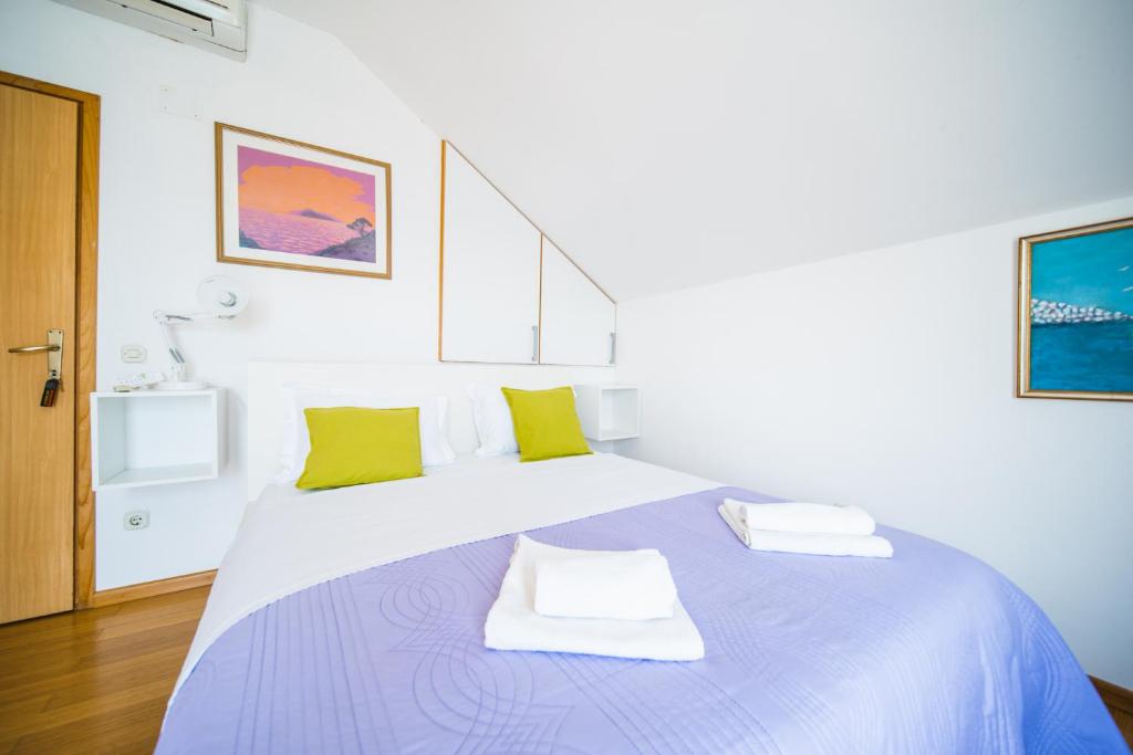 Postel nebo postele na pokoji v ubytování Rooms Denoble
