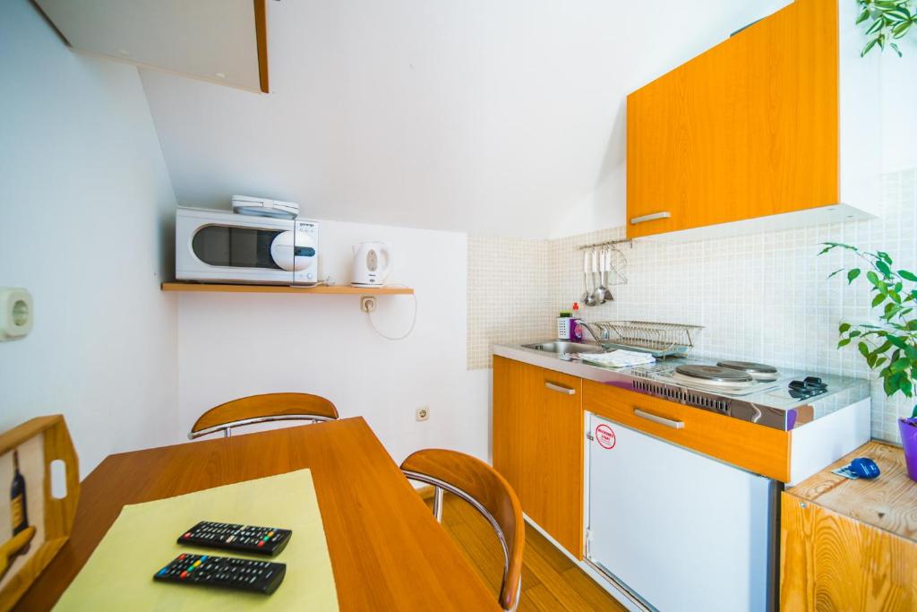 Kuchyň nebo kuchyňský kout v ubytování Rooms Denoble