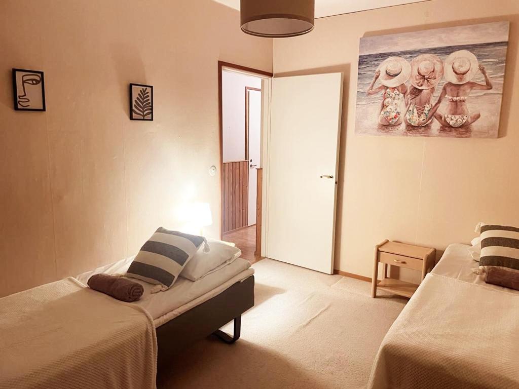 En eller flere senge i et værelse på LibO-apartment, Saarijärvi 17 with free parking