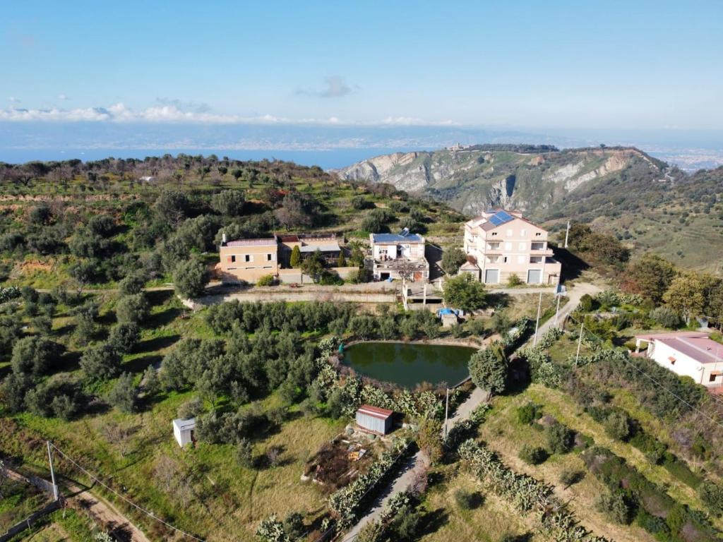 an aerial view of a house on a hill at Agriturismo Sant' Anna Ortì in Reggio di Calabria