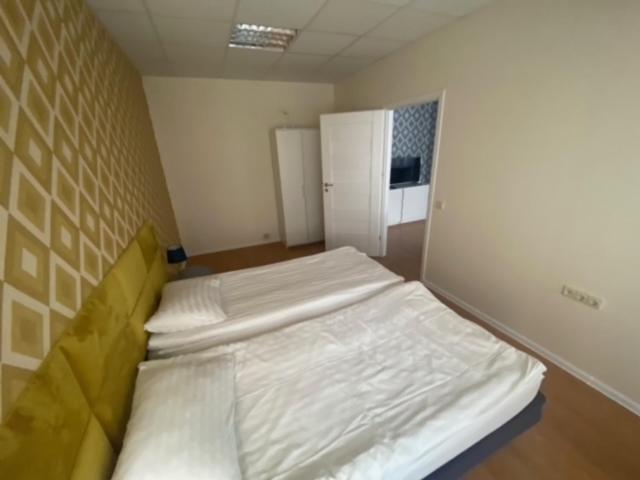 Posteľ alebo postele v izbe v ubytovaní Perlos Apartamentai 3