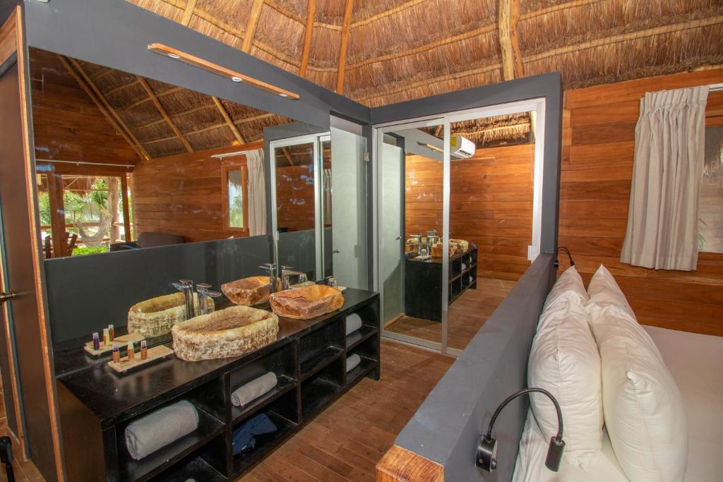 Postel nebo postele na pokoji v ubytování Blue Holbox