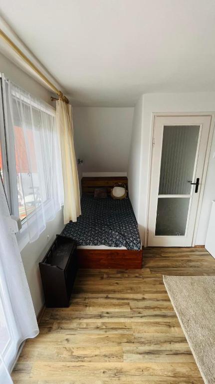 Postel nebo postele na pokoji v ubytování Hortenzia Vendégház