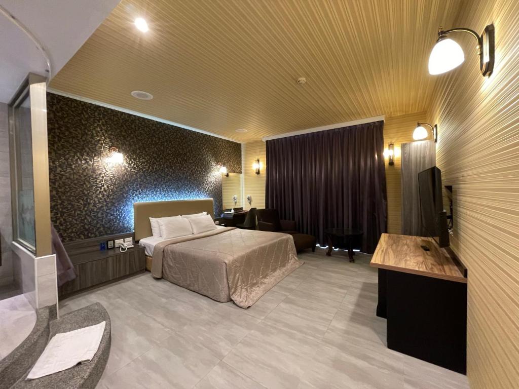 Postel nebo postele na pokoji v ubytování King & Princess Motel - Rende