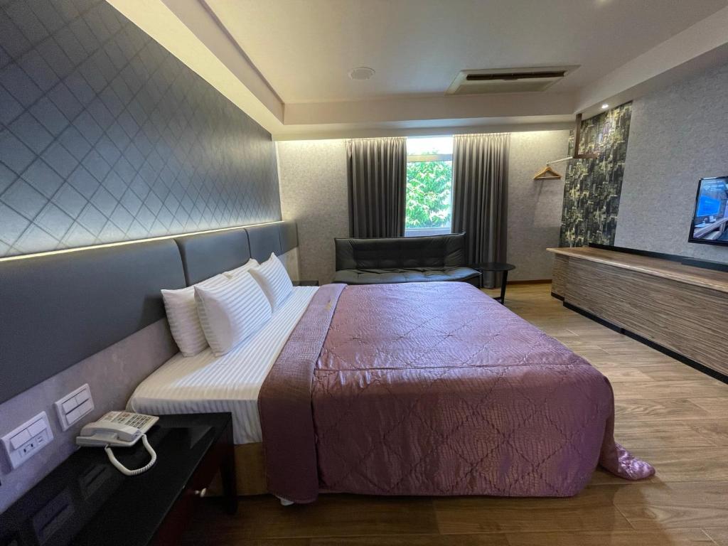 Postel nebo postele na pokoji v ubytování King & Princess Motel - Rende