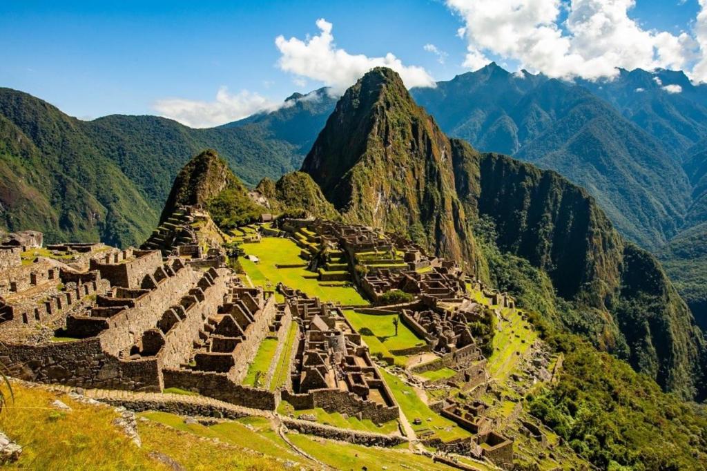 an aerial view of the ruins of machu picchu in the mountains at traverse peru in Cusco