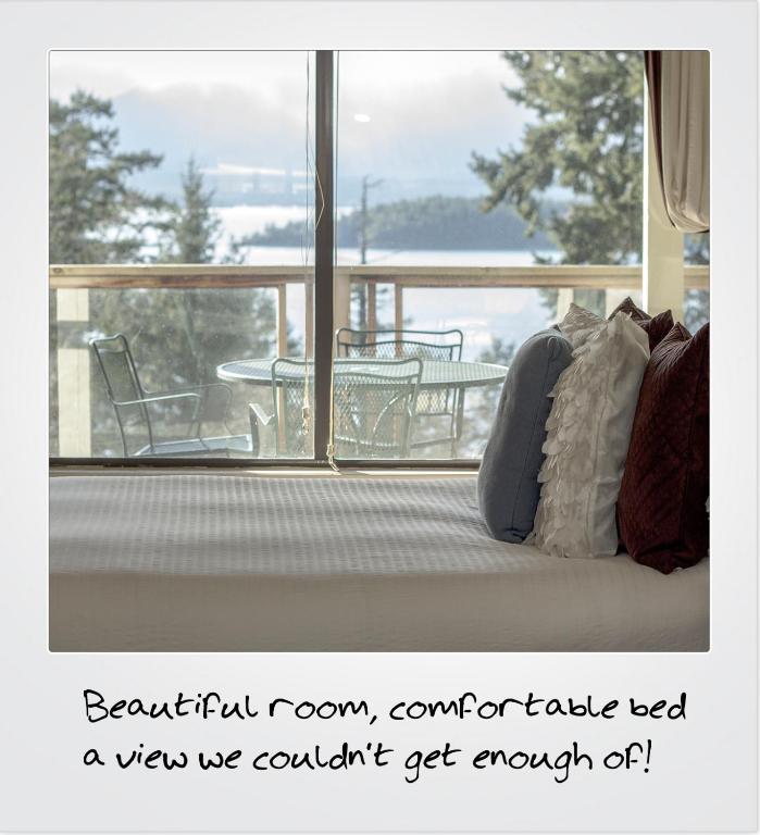 a room with a bed in front of a window at Quarrystone House B&B in Fernwood