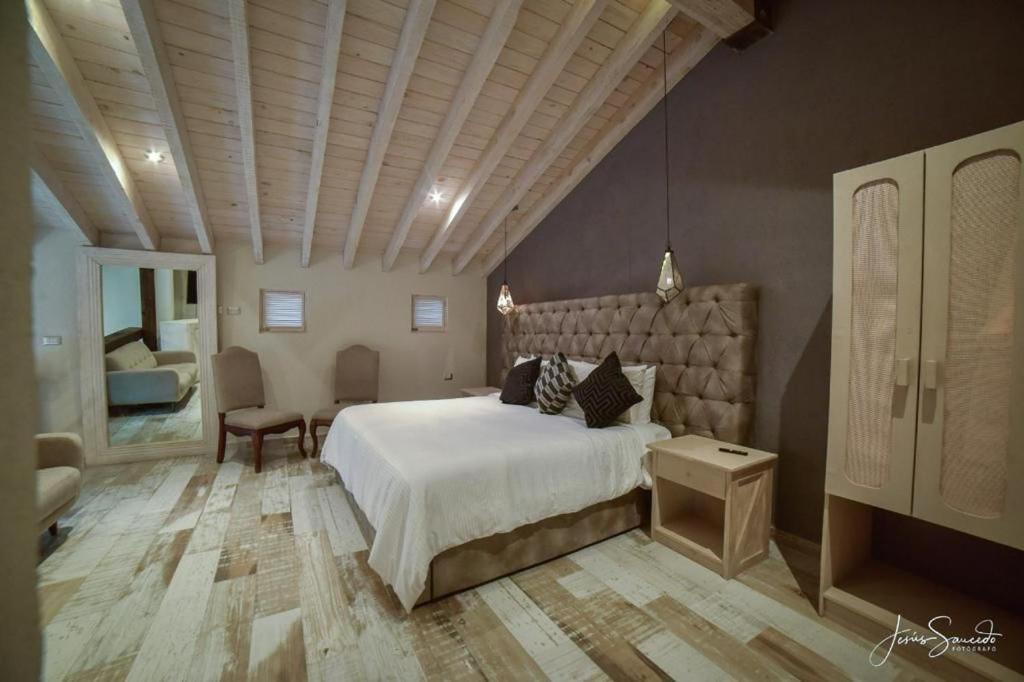 Postel nebo postele na pokoji v ubytování Suites Campestres Montebello