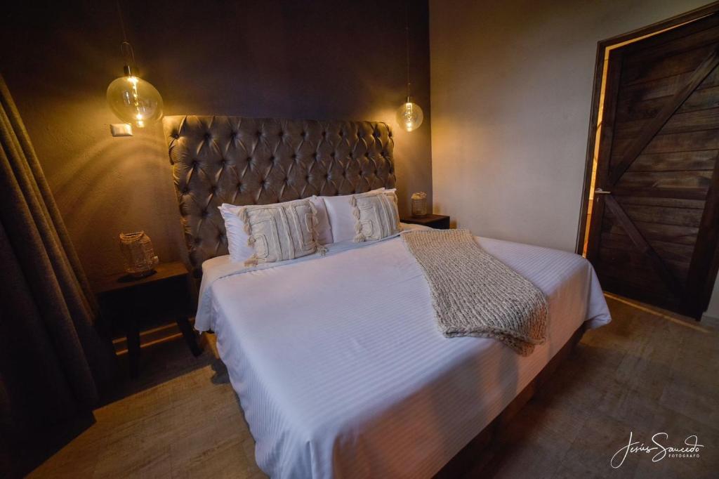 Postel nebo postele na pokoji v ubytování Suites Campestres Montebello