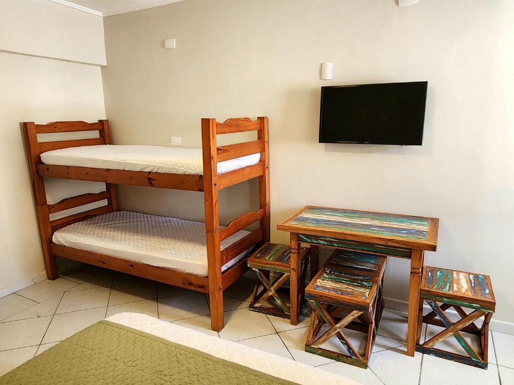 Postel nebo postele na pokoji v ubytování Flats Enseada Delphin