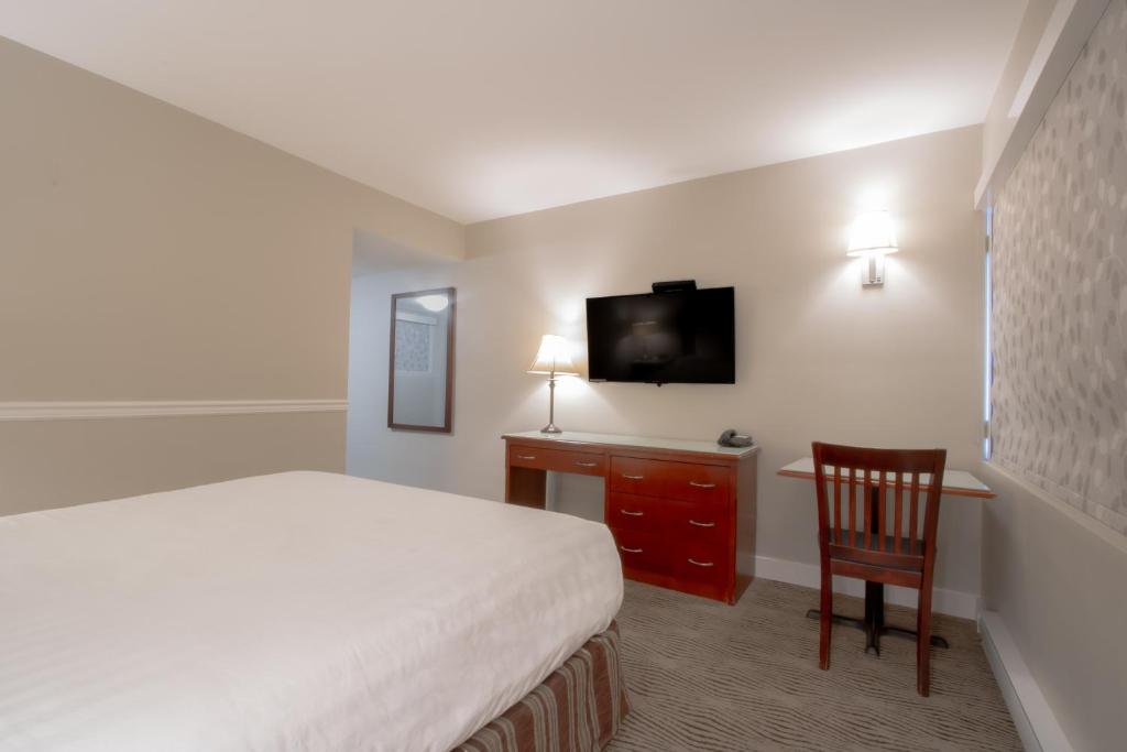 TV a/nebo společenská místnost v ubytování Scott's Inn & Suites