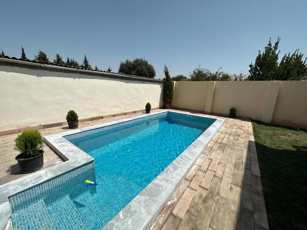a swimming pool in the backyard of a house at BakuHome in Baku