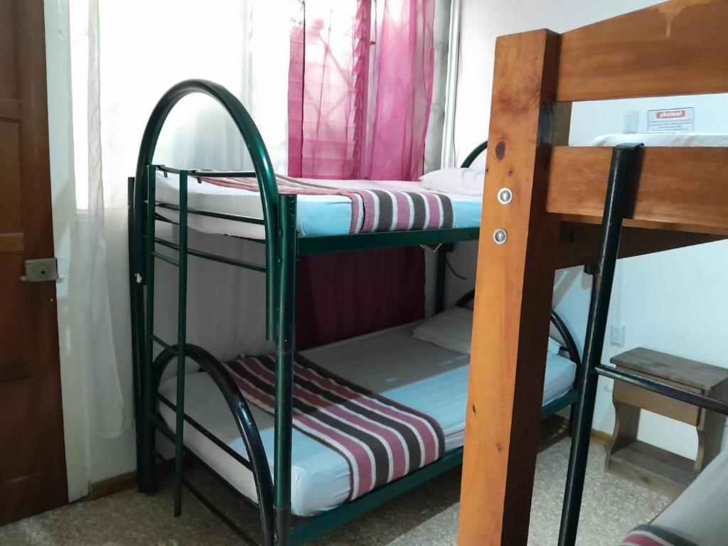 Postel nebo postele na pokoji v ubytování Gaudy's Hotel