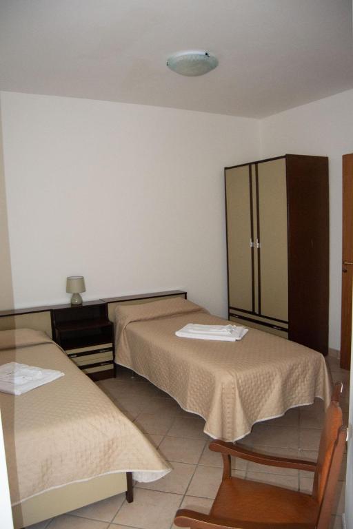 Postel nebo postele na pokoji v ubytování Residenza Il Conte