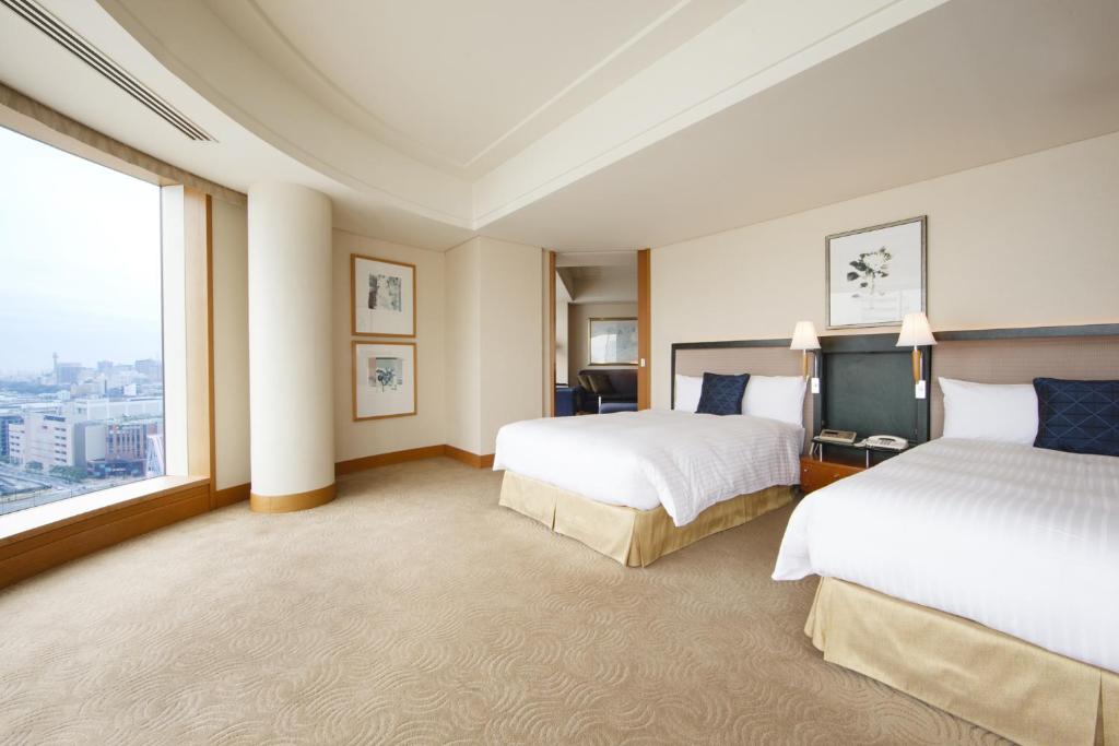 Postel nebo postele na pokoji v ubytování The Yokohama Bay Hotel Tokyu