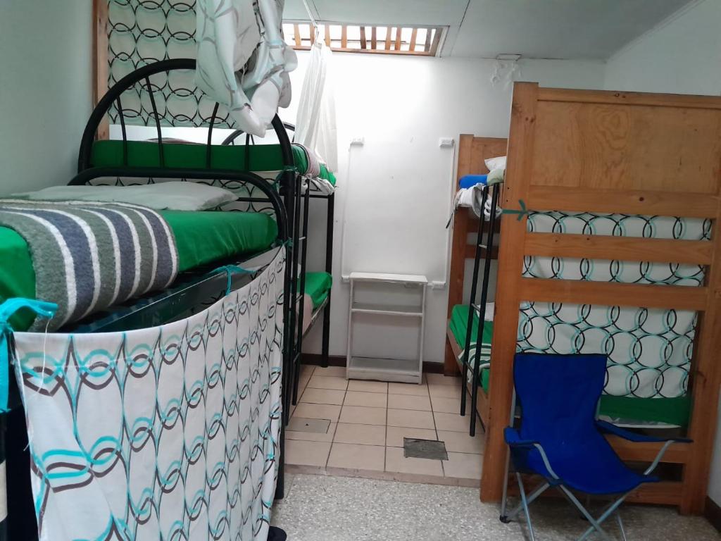 Postel nebo postele na pokoji v ubytování Gaudy's Hotel